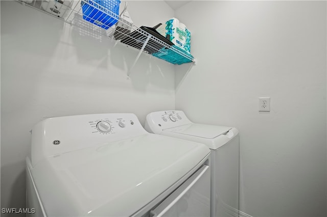 washroom with separate washer and dryer