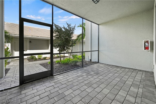 unfurnished sunroom featuring plenty of natural light