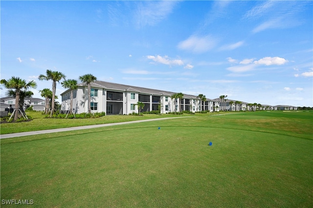 view of home's community with a lawn