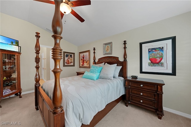 bedroom featuring vaulted ceiling, light carpet, and ceiling fan