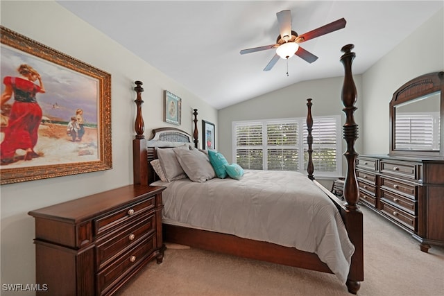 carpeted bedroom with vaulted ceiling and ceiling fan