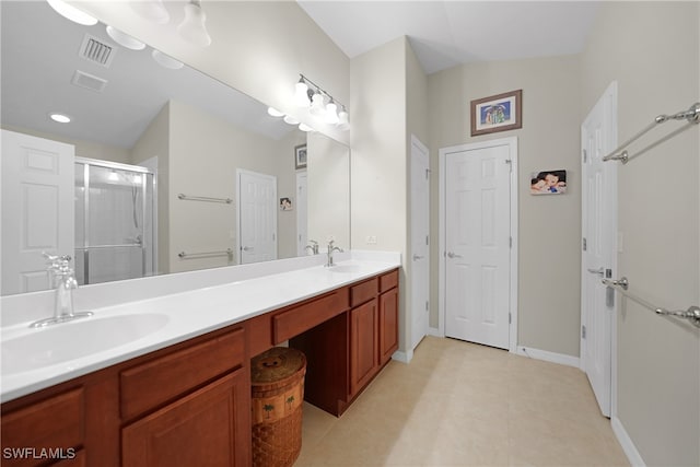 bathroom featuring an enclosed shower and vanity