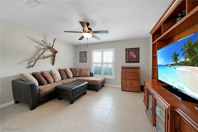 living room featuring ceiling fan and light tile patterned flooring