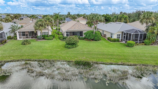 birds eye view of property with a water view