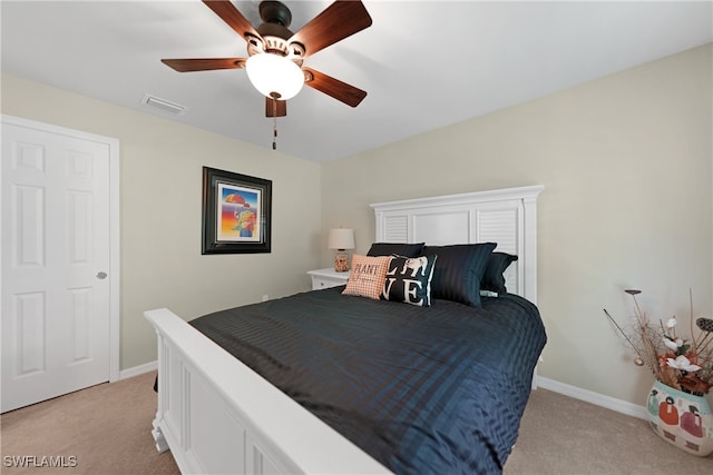 bedroom with light carpet and ceiling fan