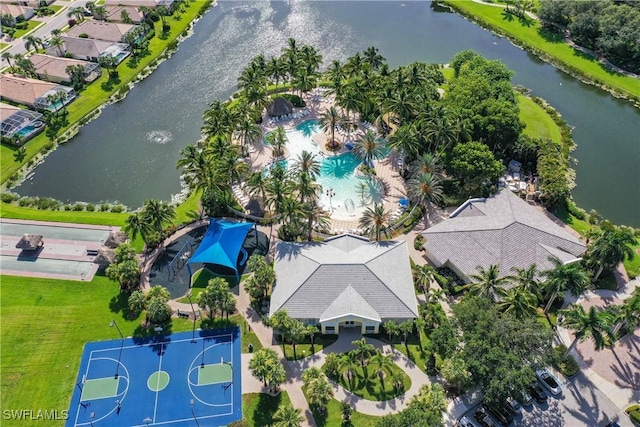 birds eye view of property with a water view