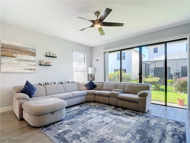 living room with ceiling fan and hardwood / wood-style flooring