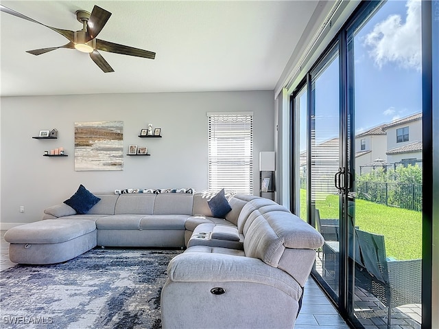 living room with hardwood / wood-style flooring and ceiling fan