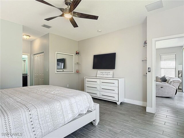 bedroom featuring a closet, ceiling fan, and wood-type flooring