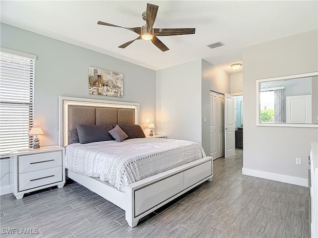 bedroom with hardwood / wood-style floors and ceiling fan