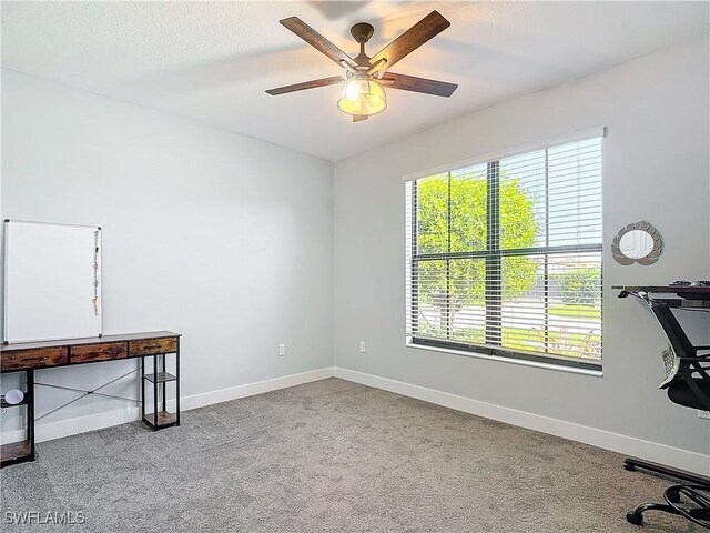 unfurnished office with light colored carpet and ceiling fan