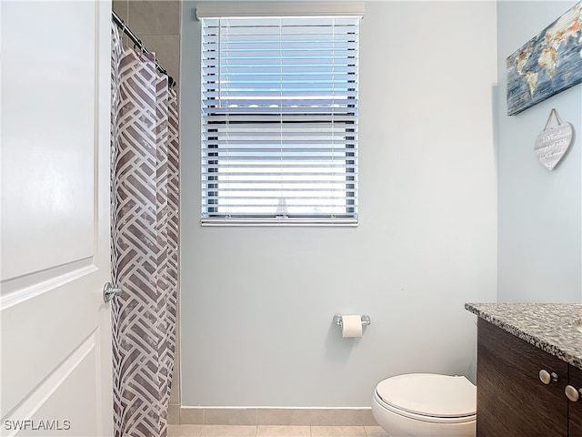 bathroom with vanity, toilet, and tile patterned floors