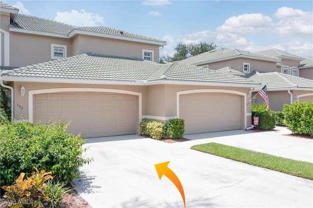 mediterranean / spanish-style home featuring a garage