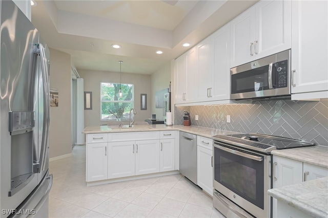 kitchen featuring appliances with stainless steel finishes, sink, and white cabinets