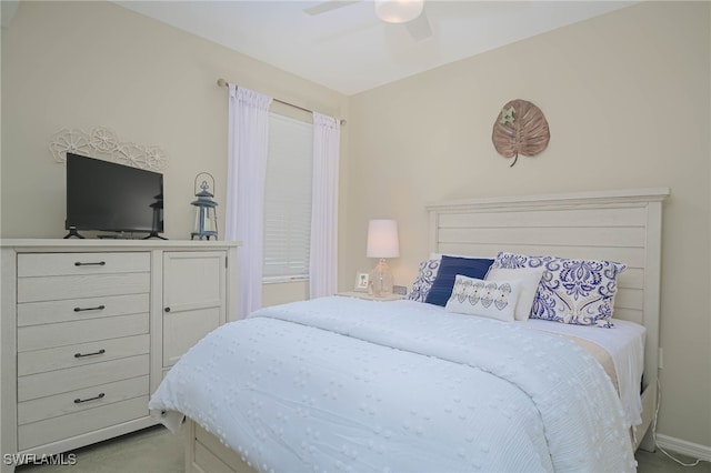 carpeted bedroom with ceiling fan