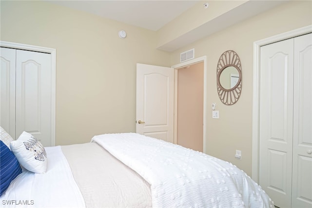 bedroom featuring visible vents