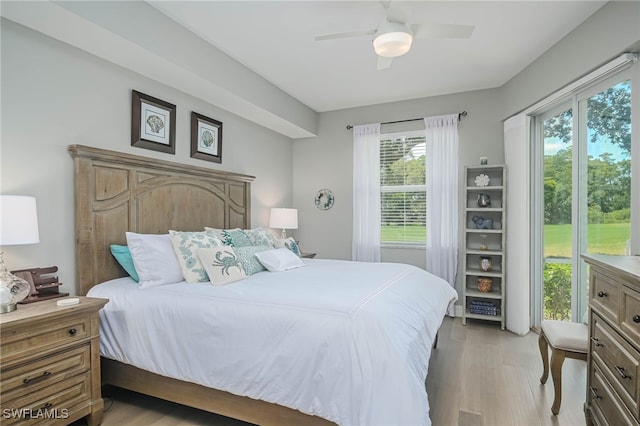 bedroom with ceiling fan and light hardwood / wood-style floors