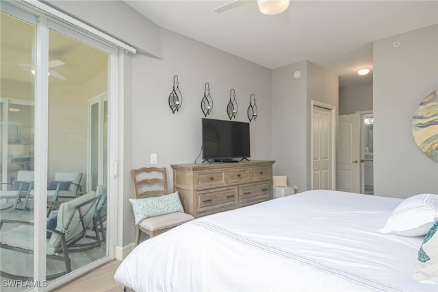 bedroom with a closet, access to exterior, ensuite bathroom, ceiling fan, and light wood finished floors