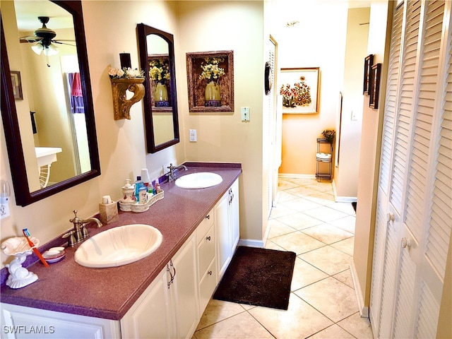 bathroom with vanity, ceiling fan, and tile patterned flooring