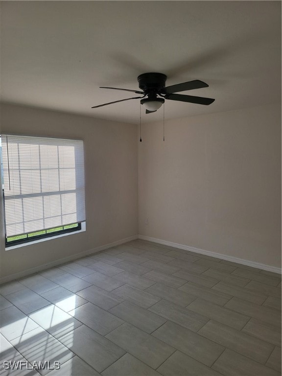 unfurnished room with ceiling fan