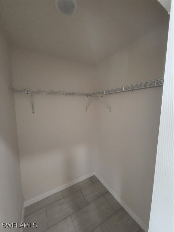 spacious closet featuring tile patterned floors