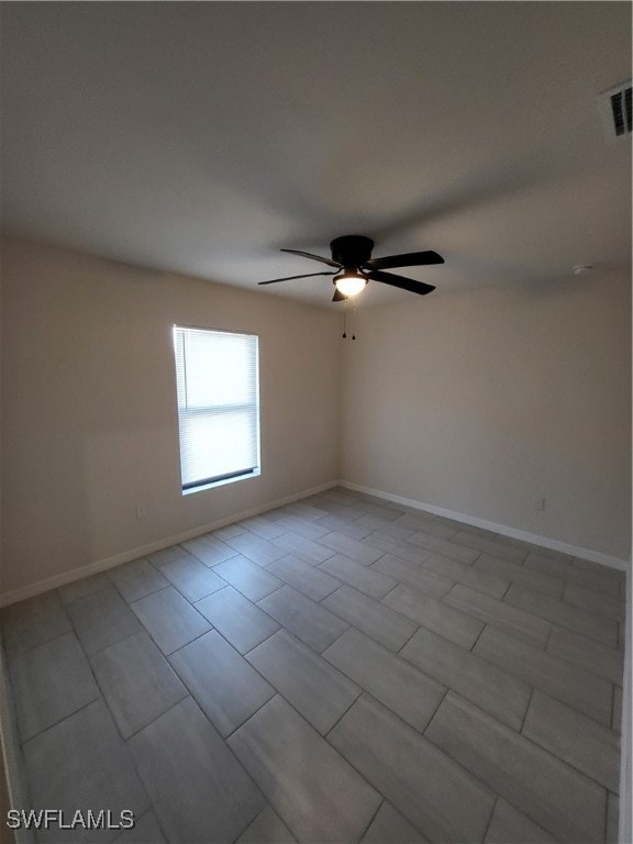 spare room featuring ceiling fan