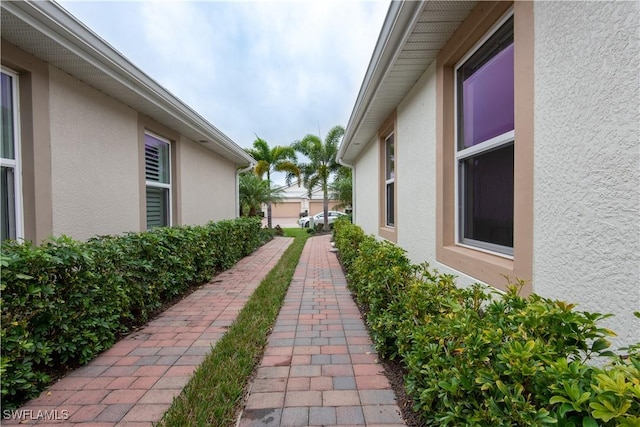 view of side of property featuring stucco siding