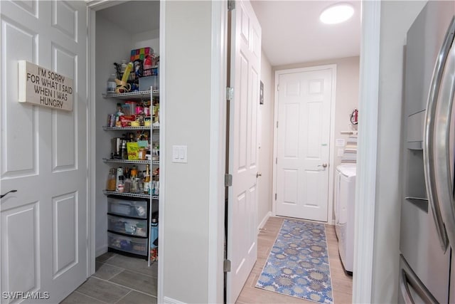 storage area featuring separate washer and dryer