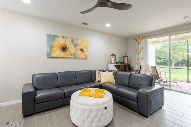 living room with a ceiling fan, recessed lighting, visible vents, and baseboards