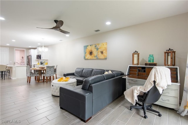 living room with recessed lighting, visible vents, ceiling fan, and wood finish floors