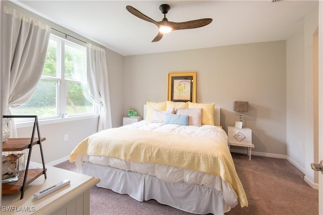 carpeted bedroom featuring ceiling fan and baseboards