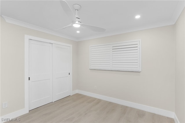 unfurnished bedroom featuring light wood finished floors, baseboards, a closet, and recessed lighting