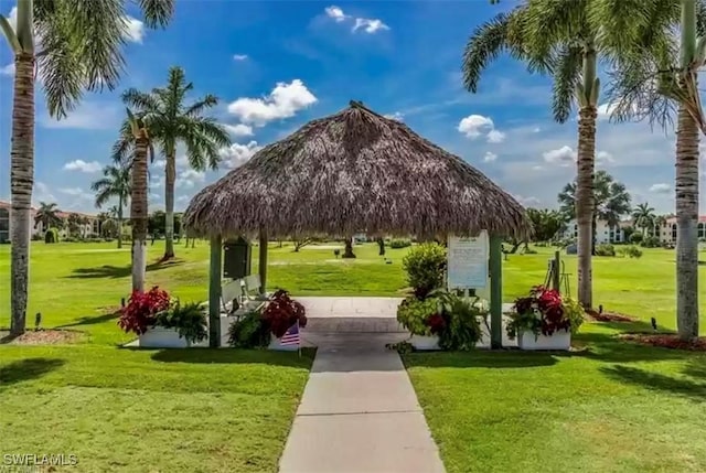 surrounding community with a gazebo and a yard