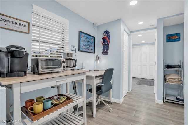 office area with light wood-type flooring