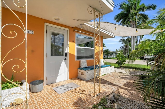 doorway to property featuring a patio area