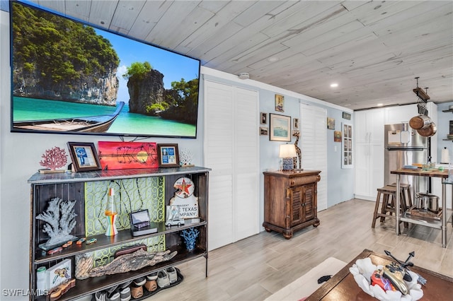 interior space featuring light hardwood / wood-style floors and wooden ceiling