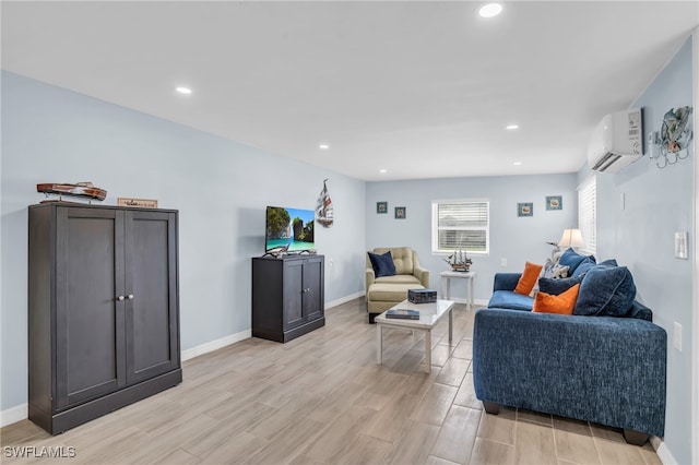 living room featuring a wall mounted AC and light hardwood / wood-style flooring