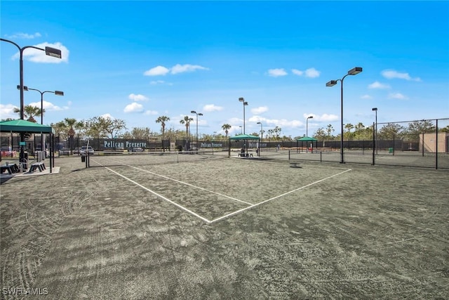 view of tennis court with fence