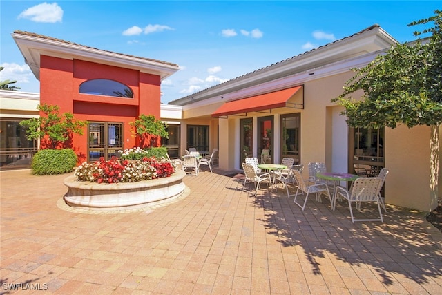 rear view of house with a patio