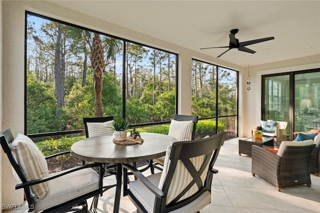 sunroom featuring ceiling fan