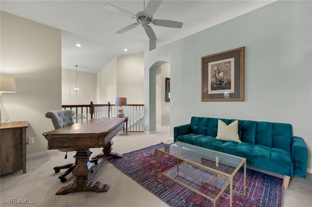 carpeted home office featuring baseboards, arched walkways, a ceiling fan, and recessed lighting