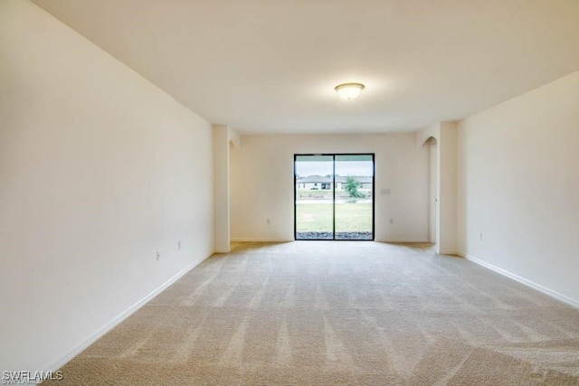 empty room featuring light carpet