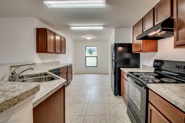 kitchen with black appliances, light tile patterned flooring, and sink