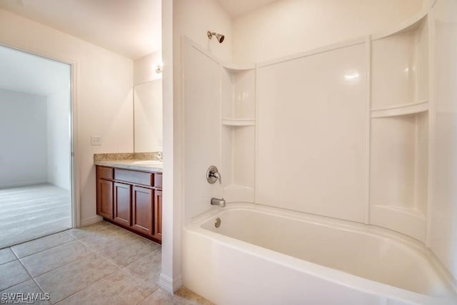 bathroom featuring vanity, tile patterned floors, and bathing tub / shower combination