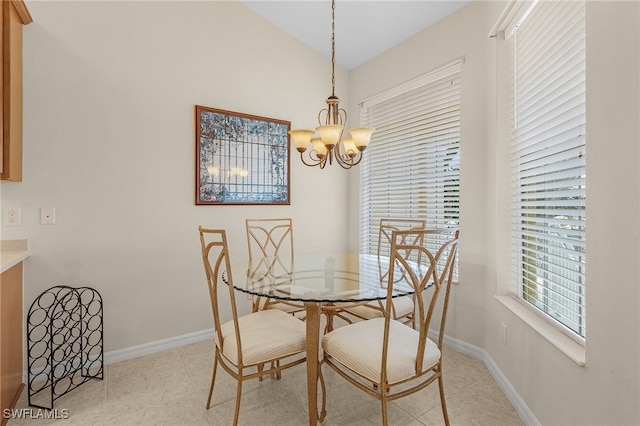 dining space featuring an inviting chandelier