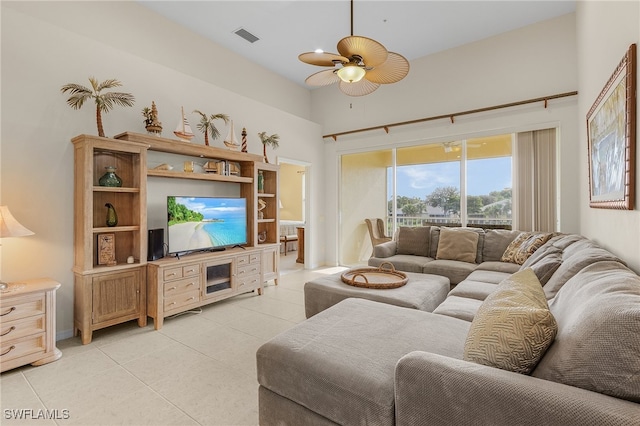 living room with light tile patterned flooring and ceiling fan