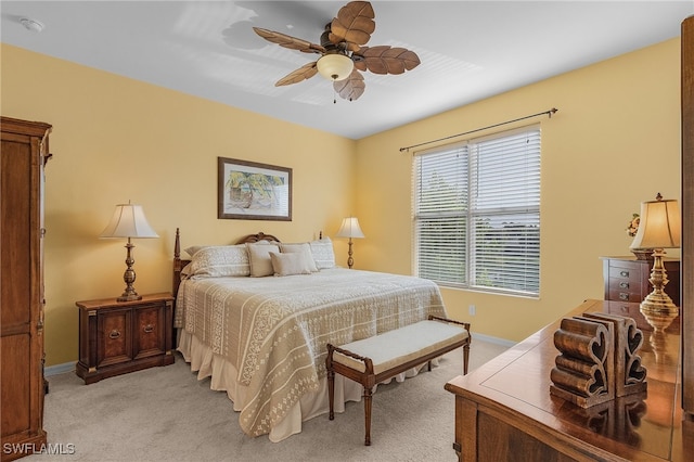 bedroom featuring ceiling fan and light colored carpet