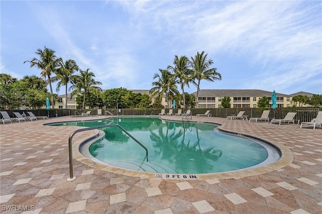 view of swimming pool with a patio