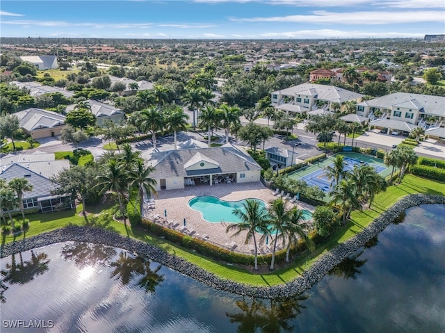 birds eye view of property with a water view