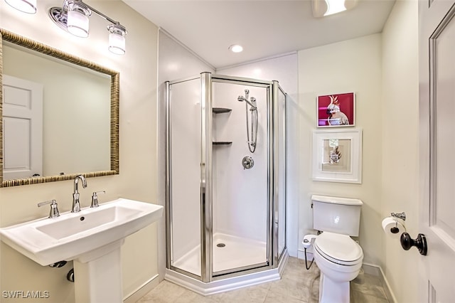 full bath with a stall shower, toilet, tile patterned flooring, a sink, and recessed lighting